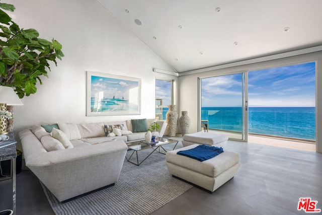 living room featuring a water view and high vaulted ceiling