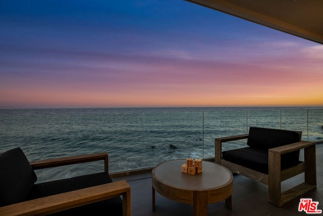 balcony at dusk with a water view