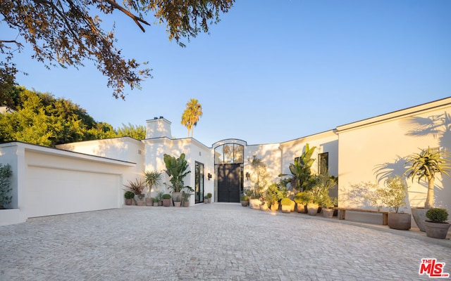 view of front of property with a garage