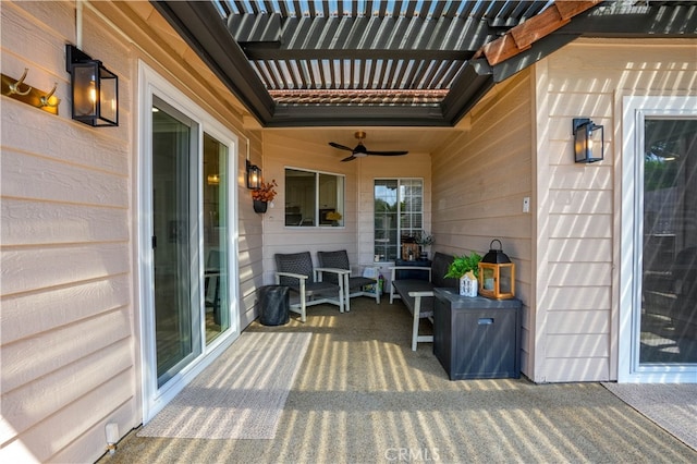 wooden terrace featuring ceiling fan and a patio area