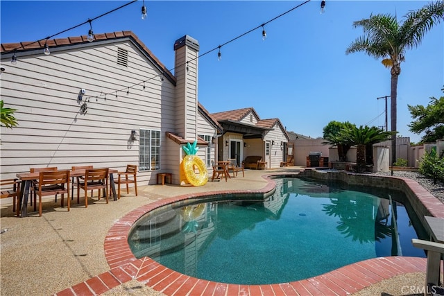 view of swimming pool featuring a patio