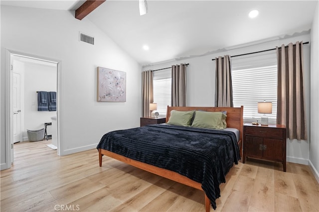 bedroom with light wood-type flooring and vaulted ceiling with beams