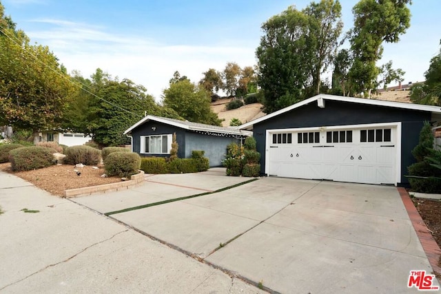 ranch-style home with a garage