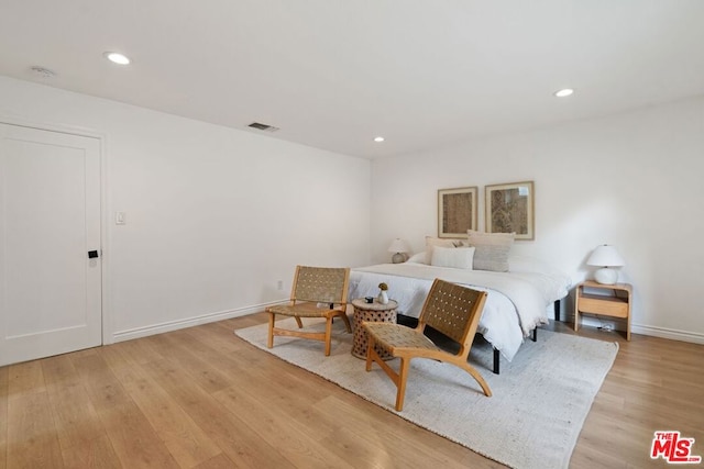 bedroom with light hardwood / wood-style flooring