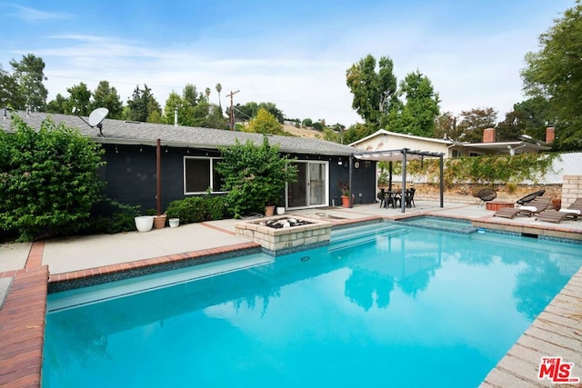 view of pool with a patio area and an in ground hot tub