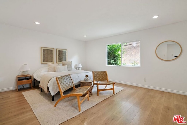 bedroom with light hardwood / wood-style floors