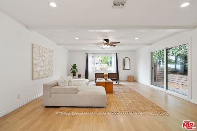 living room with beam ceiling, ceiling fan, and light hardwood / wood-style flooring