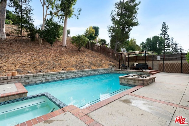 view of pool featuring a pergola, an in ground hot tub, and a patio