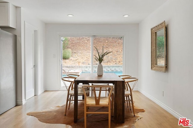 dining area with light hardwood / wood-style flooring