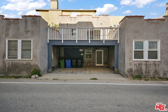 exterior space featuring a balcony