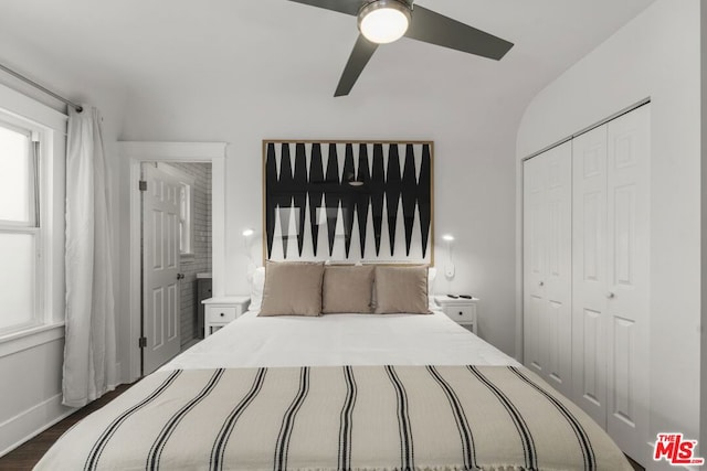 bedroom featuring dark wood-type flooring, ceiling fan, and a closet