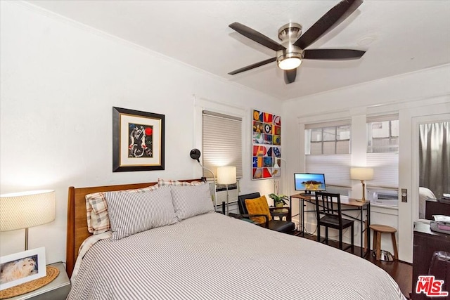 bedroom featuring ornamental molding and wood-type flooring