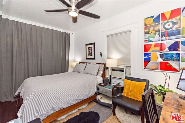 bedroom featuring cooling unit and ceiling fan