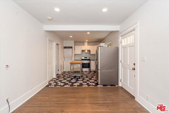 kitchen featuring tasteful backsplash, wood-type flooring, and appliances with stainless steel finishes