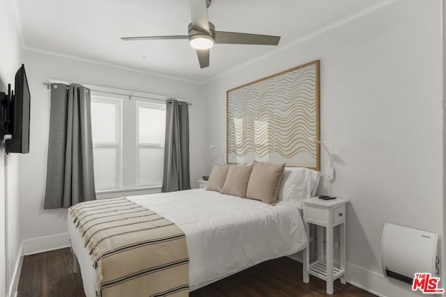 bedroom with ornamental molding, dark hardwood / wood-style floors, and ceiling fan