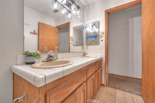 bathroom with vanity and tile patterned flooring