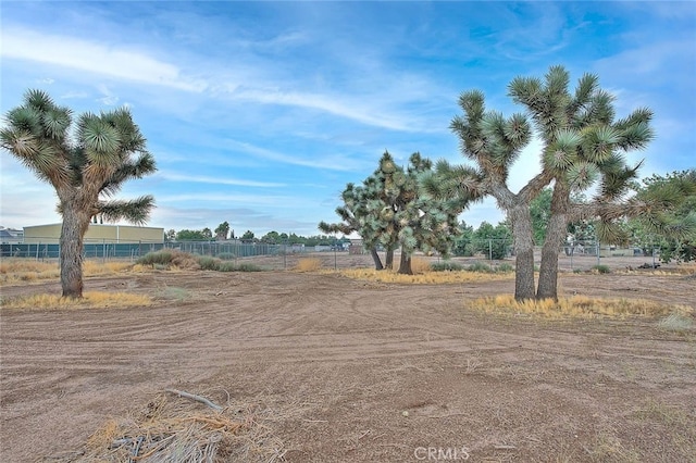 view of yard with a rural view