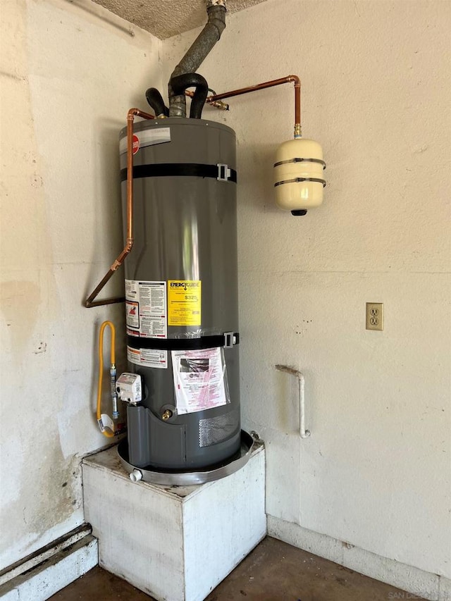 utility room with secured water heater