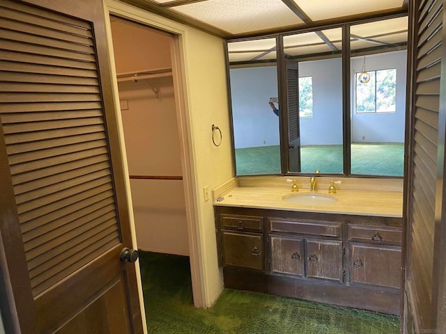 bathroom with vanity and a textured ceiling