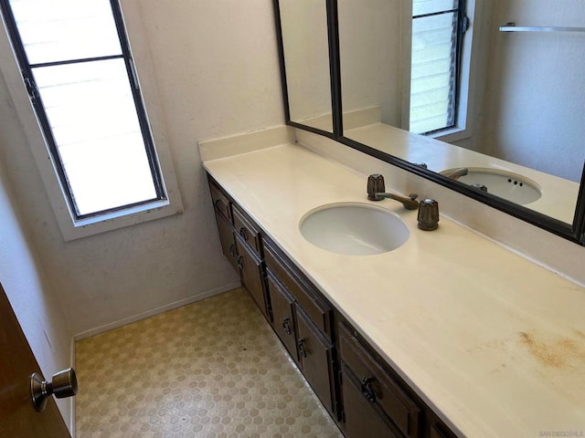 bathroom featuring vanity and plenty of natural light