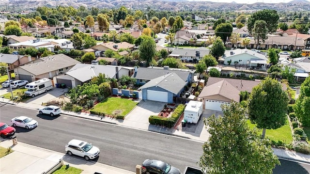 birds eye view of property with a mountain view