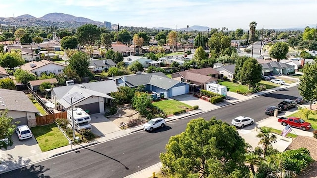 birds eye view of property with a mountain view