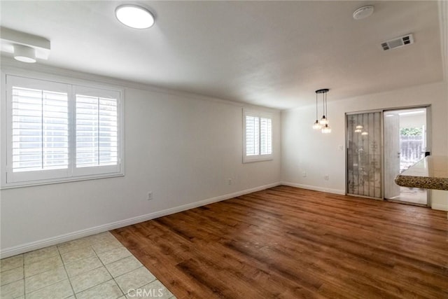 spare room featuring plenty of natural light