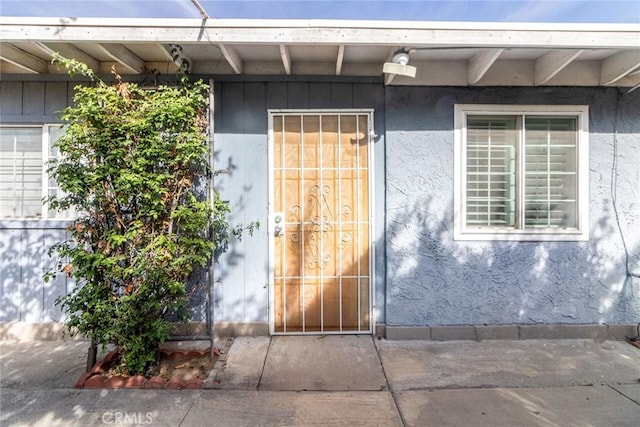 doorway to property featuring a patio