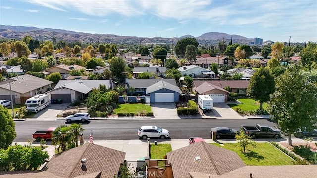 birds eye view of property featuring a mountain view