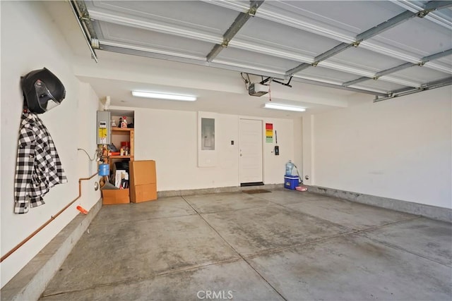 garage with electric panel, water heater, and a garage door opener