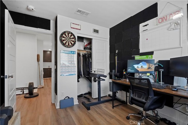 office space with light hardwood / wood-style flooring