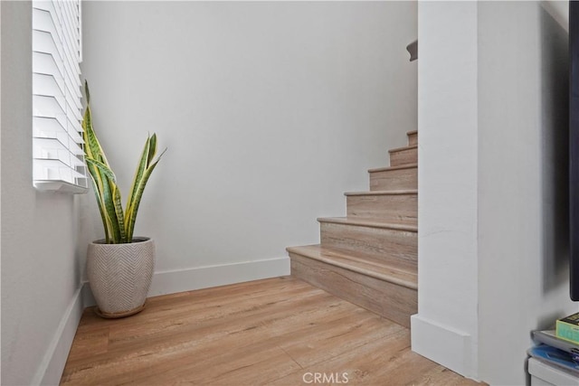 staircase featuring hardwood / wood-style floors