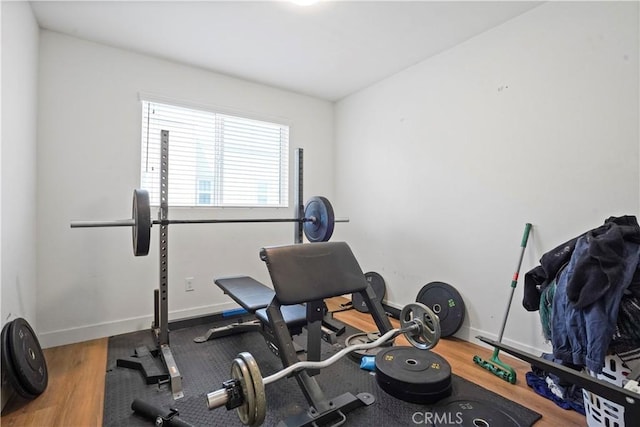 workout area featuring hardwood / wood-style floors