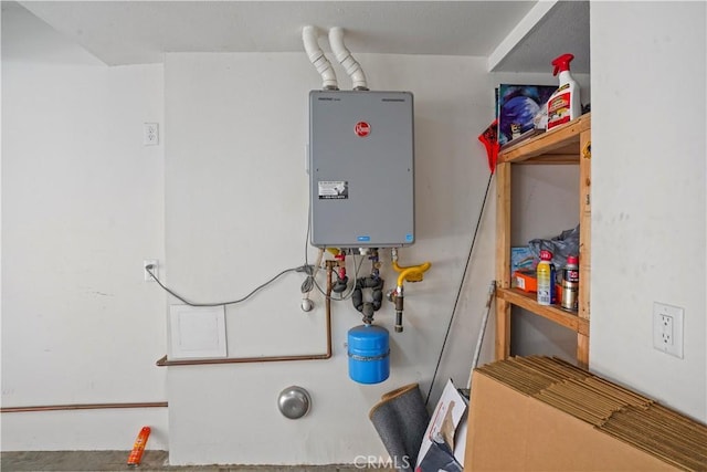 utility room featuring water heater