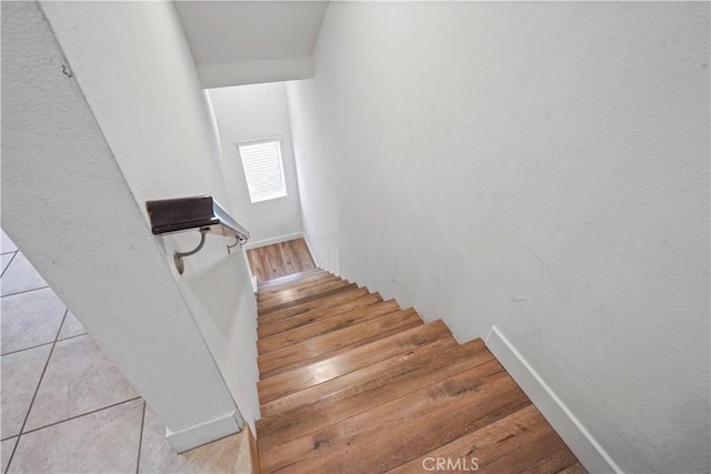 staircase featuring hardwood / wood-style floors