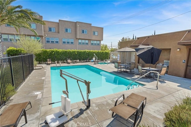 view of swimming pool with a patio