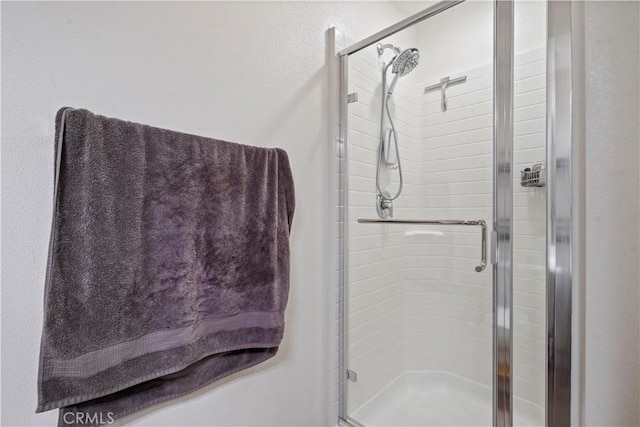 bathroom featuring an enclosed shower