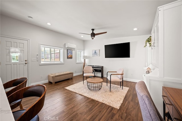 living room with ceiling fan, dark hardwood / wood-style flooring, and a wall mounted AC