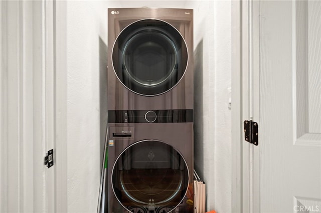 clothes washing area with stacked washer / drying machine