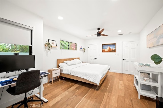 bedroom featuring ceiling fan and light hardwood / wood-style flooring