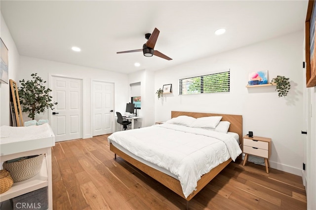 bedroom featuring hardwood / wood-style floors and ceiling fan