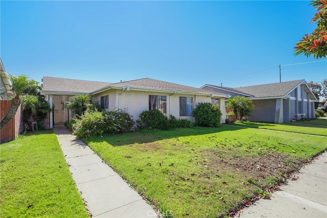 ranch-style home featuring a front lawn