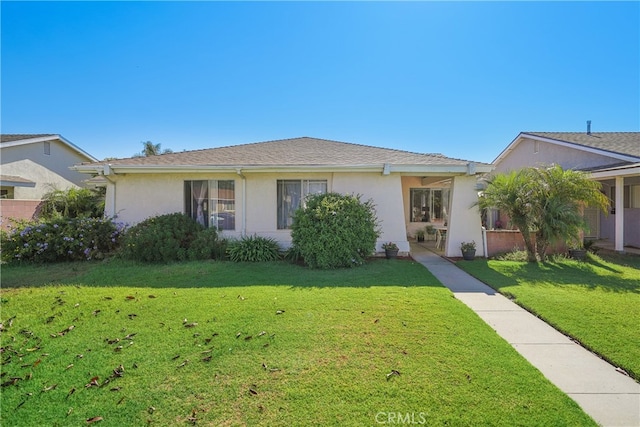 single story home featuring a front yard