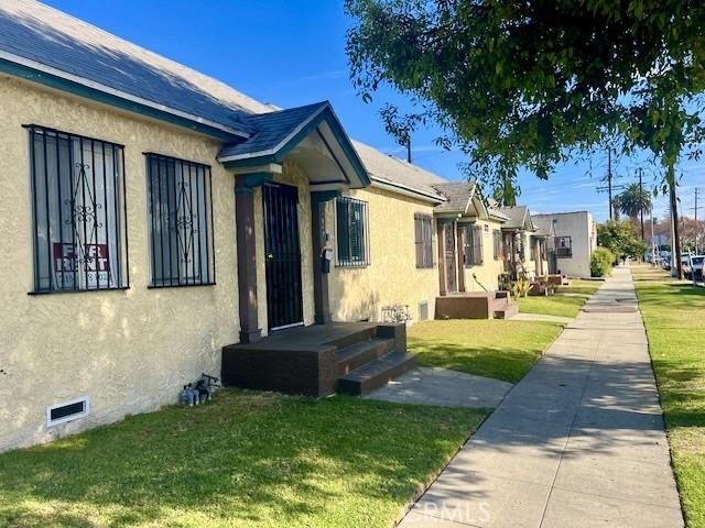 view of side of property with a yard