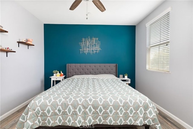 bedroom featuring ceiling fan and hardwood / wood-style floors