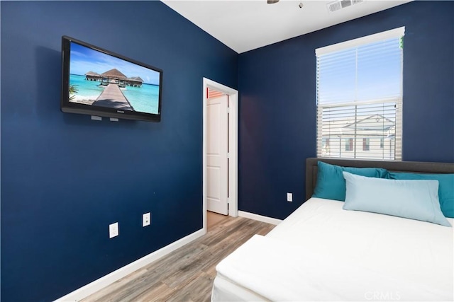 bedroom featuring wood-type flooring