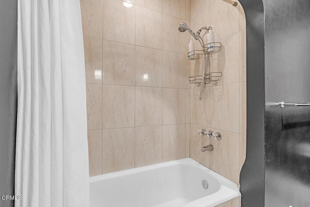 bathroom with shower / bathtub combination with curtain