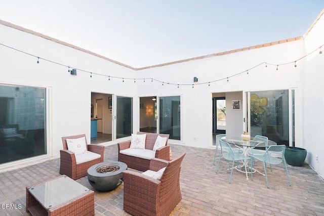 view of patio / terrace with a fire pit