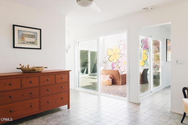 tiled bedroom with access to outside and ceiling fan