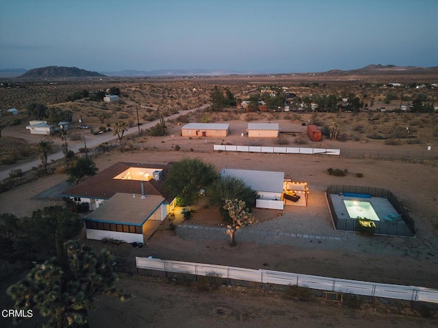 birds eye view of property featuring a mountain view